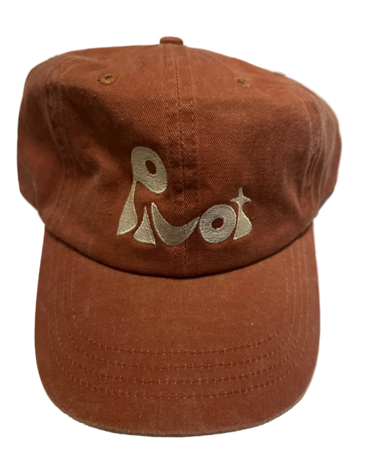 Red cap with "Pivot" embroidered in cream color.